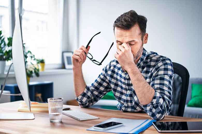 Person in Tension with Specs in his hand