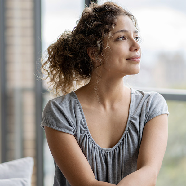 thoughtful woman at home